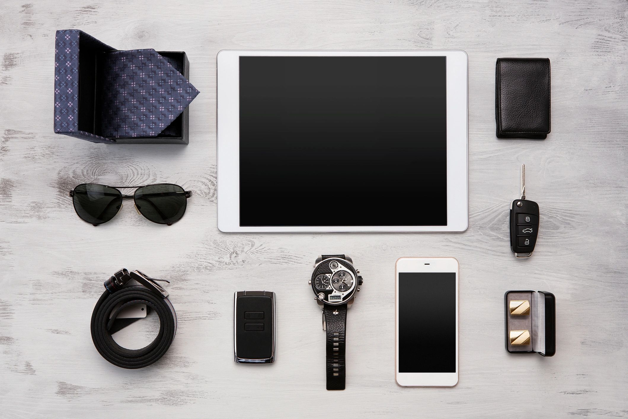 Luxury watch and accessories arranged in a premium display